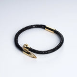 Wrap Soudage Black & Gold leather bracelet, angled view showing the textured leather surface