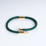 Wrap Soudage Green & Gold textured leather bracelet with gold nail clasp, viewed from above