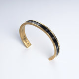 Sultana Cuff Black & Gold cuff bracelet, angled view showing the serrated edge and beaded row