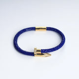 Wrap Soudage Blue & Gold textured leather bracelet with gold nail clasp, viewed from above
