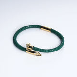 Wrap Soudage Green & Gold leather bracelet, angled view showing the textured leather surface